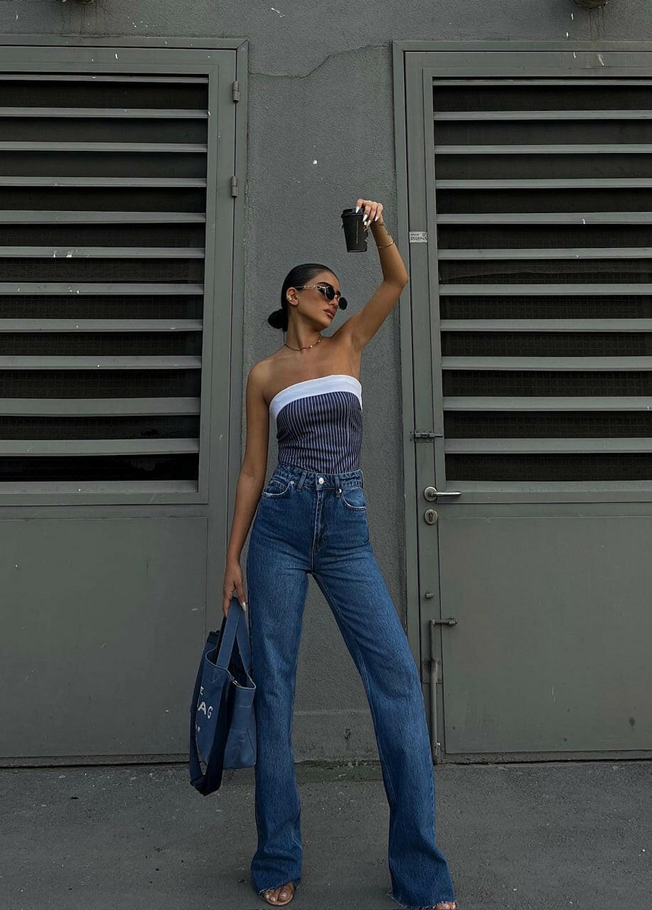 Steal the Spotlight: Asymmetrical Jeans with Statement Belt and Slit Hems